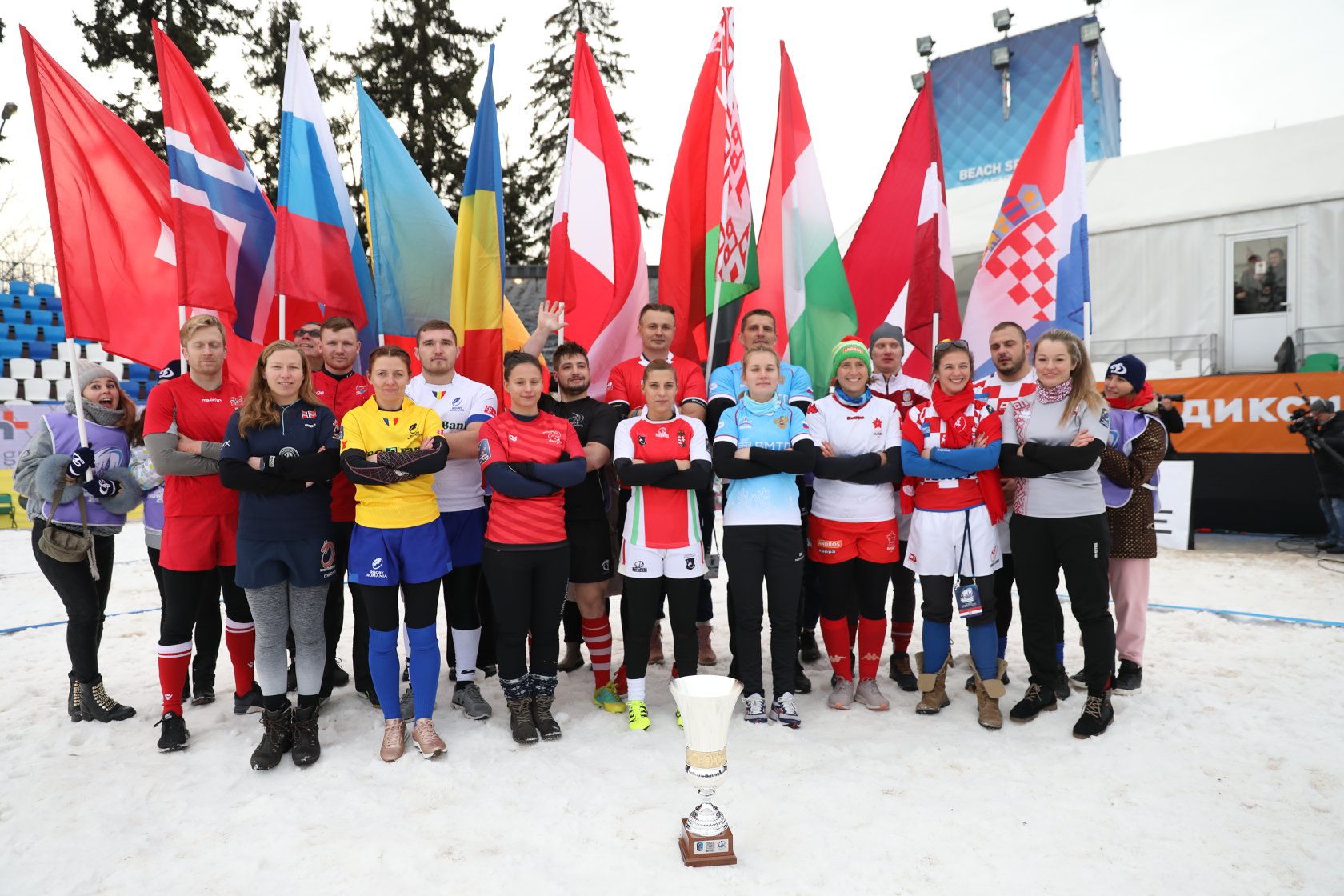Captains line up with the trophy